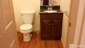 Frostburg apartment for rent - A white toilet sits next to a sink in a small bathroom.