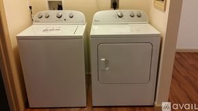 Frostburg apartment for rent - Two white front loading washing machines in a laundry room.
