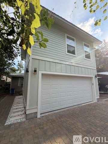 Santa Rsa Bch apartment for rent - A kitchen with a stainless steel refrigerator and wooden flooring.