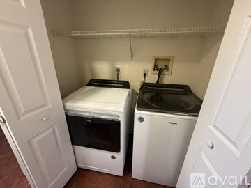 Severna Park apartment for rent - A small kitchen with a white oven and a white fridge.
