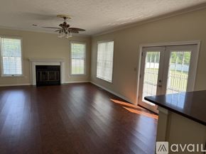 Severna Park apartment for rent - A bedroom with a bed and a chair.