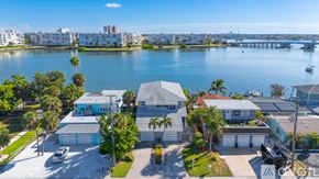 St. Pete Beach apartment for rent - A spacious room with wooden floors and a ceiling fan.