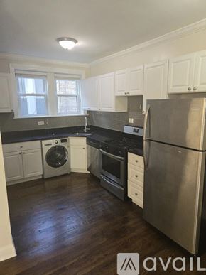 Chicago apartment for rent - A kitchen with a stainless steel refrigerator, dishwasher, and oven.