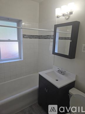 Chicago apartment for rent - A bathroom with a sink, toilet and bathtub.