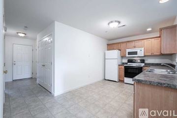 Mountville apartment for rent - A kitchen with white cabinets and a marble countertop.