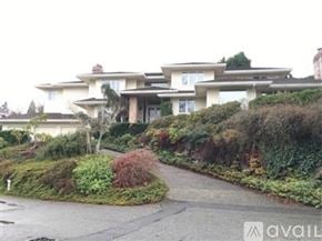 Mercer Island house for rent - A large house with a driveway in front of it.