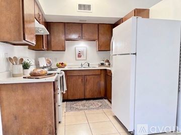Phoenix apartment for rent - A living room with a grey rug and a sliding glass door.
