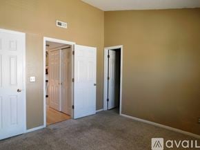 Aurora apartment for rent - A living room with a staircase and a potted plant.