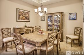 Fort Myers house for rent - A dining room with a wooden table and chairs.