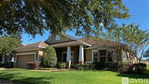 Brooksville house for rent - A house with a garage and a front yard.