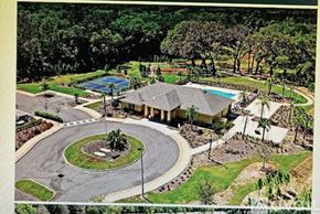 Brooksville house for rent - A large house with a pool and a circular driveway.