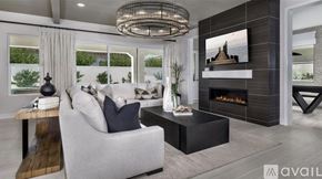 Indian Wells apartment for rent - A modern living room with a fireplace and a large screen TV.