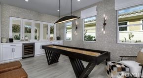 Indian Wells apartment for rent - A modern kitchen with a large island in the center.