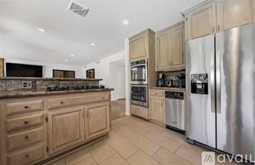 Indian Wells apartment for rent - A kitchen with wooden cabinets and stainless steel appliances.