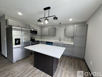 Nicollet apartment for rent - A modern kitchen with a large island in the center.