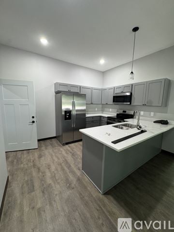 Nicollet apartment for rent - A kitchen with a white door and a sink.