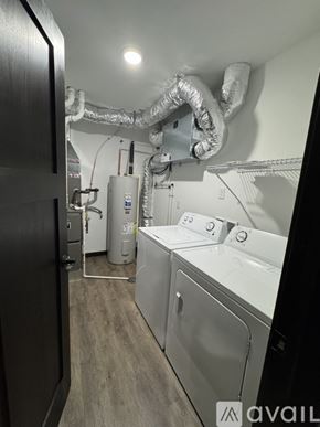 Nicollet apartment for rent - A laundry room with a washer and dryer.