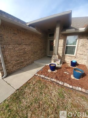 Oklahoma City apartment for rent - A kitchen with a granite countertop and a cabinet with plates and cups.