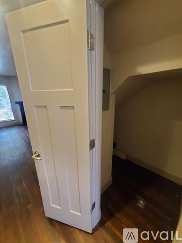 Taylorsville house for rent - A kitchen with a white microwave oven mounted above a stove.