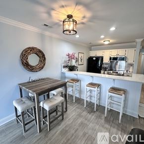 Cornelius condo for rent - A house with a grey exterior and a white balcony.