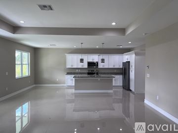 Labelle house for rent - A spacious kitchen with a large island in the middle.