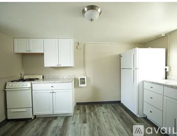 Mitchell apartment for rent - A kitchen with white appliances and cabinets.