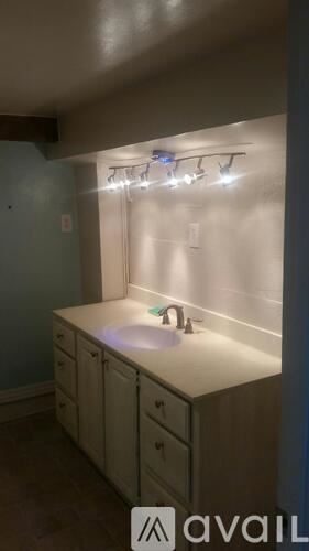 Oviedo apartment for rent - A bathroom with a sink and lights above it.