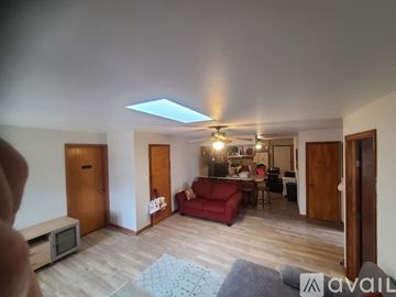 Oviedo apartment for rent - A living room with a red couch and a television.