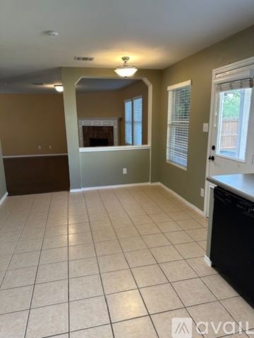 San Antonio apartment for rent - A kitchen with a black dishwasher and a tiled floor.