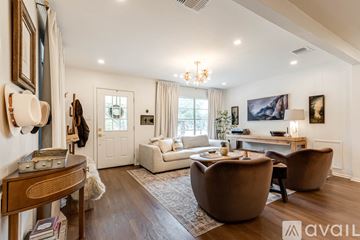 Boerne house for rent - A living room with a brown chair and a wooden table.