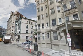 Boston apartment for rent - A street view of a building with a sign for Boston Property Real Estate.