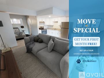 Phoenix apartment for rent - A living room with a grey sofa and a sign offering a free first month for a move in special.