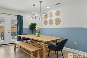 Irving house for rent - A dining room with a wooden table and chairs.