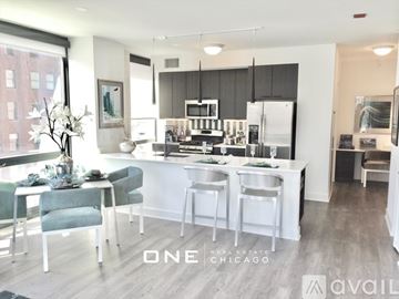 Chicago apartment for rent - A modern kitchen with a dining table and chairs.