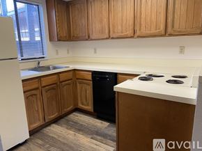 Salem apartment for rent - A white stove and refrigerator in a kitchen.