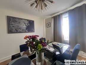 Brookline apartment for rent - A dining room with a table set for four and a painting on the wall.