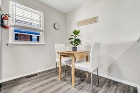 Marlton apartment for rent - A small dining room with a wooden table and white chairs.