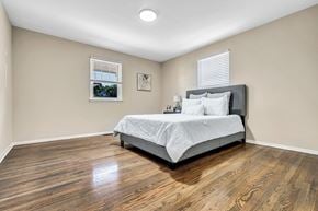Marlton apartment for rent - A bedroom with a bed, pillows, and a picture on the wall.