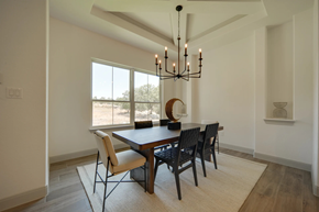 Spring Branch house for rent - A dining room with a wooden table and chairs.