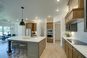 Spring Branch house for rent - A modern kitchen with wooden cabinets and a large island.