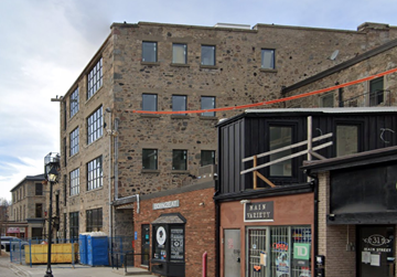 Cambridge apartment for rent - A brick building with a sign that says "Main Street Variety.".