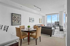 Calgary apartment for rent - A dining room with a table and chairs.