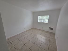 Fort Myers apartment for rent - A room with a window and tiled floor.