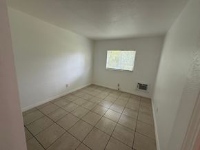 Fort Myers apartment for rent - A room with a window and tiled floor.