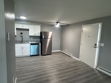 Dayton apartment for rent - A kitchen with a refrigerator and a sink.