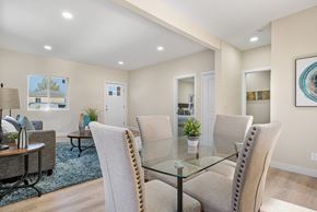 Englewood house for rent - A dining room with a glass table and chairs.