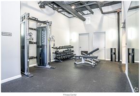 Newark apartment for rent - A fitness center with a variety of equipment including a leg press machine.