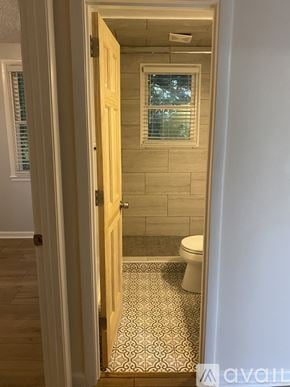 Nashville apartment for rent - A bathroom with a toilet and a shower.
