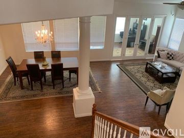 Bakersfield house for rent - A living room with a dining table and chairs.