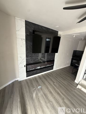 Mesquite house for rent - A bedroom with a white bed and carpeted floor.